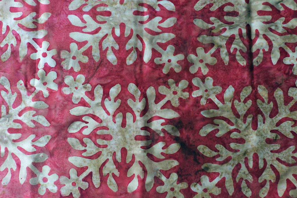 Red/Brown with a snowflake print - Hoffman Fabrics - Bali Batik Handprints