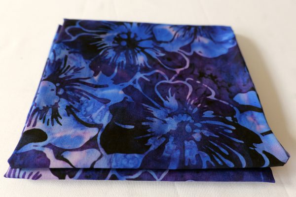 Purple fabric with a blue floral print - Hoffman Fabrics - Bali Batik Handprints – Sku 3361 518