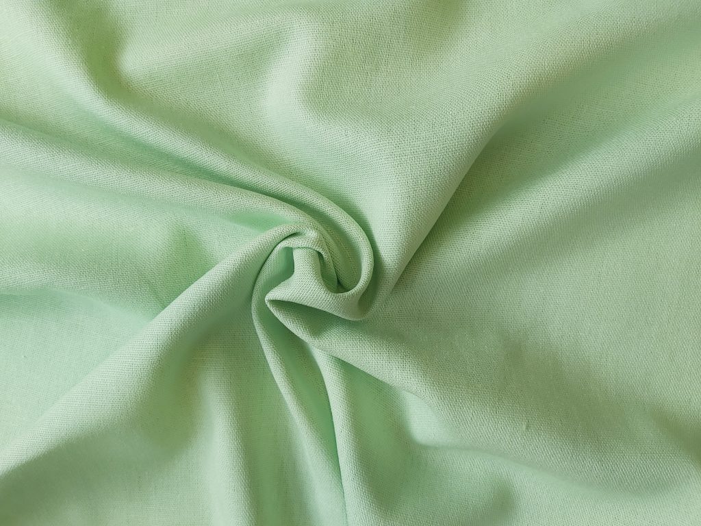 Linen Rayon blend dressmaking fabric in Apple Green