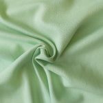 Linen Rayon blend dressmaking fabric in Apple Green