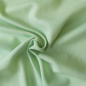 Linen Rayon blend dressmaking fabric in Apple Green