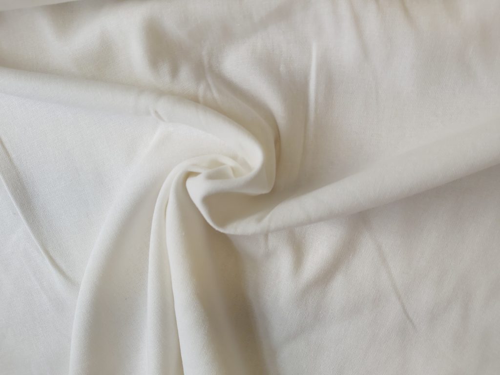 Linen Rayon blend dressmaking fabric in Off White